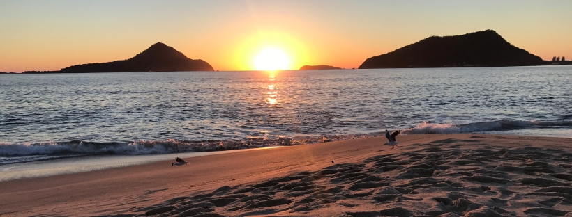 Sun is rising at the beach in Shoal Bay